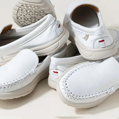 Minnetonka Women's Discover Deerskin - White