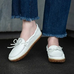 Minnetonka Women's Deerskin Tread - White