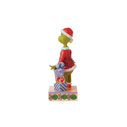 The Grinch Leaning on Gifts