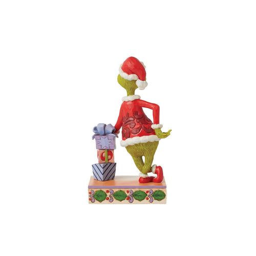 The Grinch Leaning on Gifts